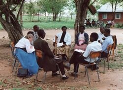 Mary Tiffen in a group discussion